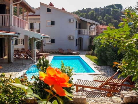 Water, Plant, Building, Property, Swimming Pool, Window, Sky, Azure, Chair, Flower