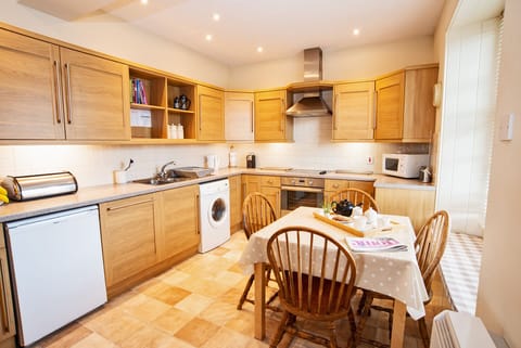 Kitchen/dining room with east facing window for the morning sunshine.