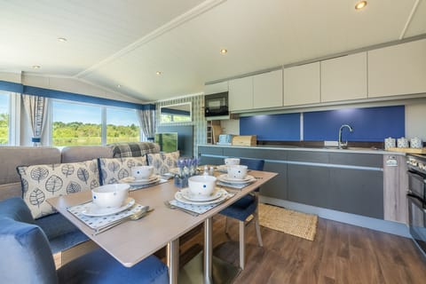 Boasting a large open-plan sitting room, kitchen and dining area