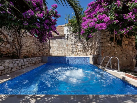 Water, Flower, Plant, Property, Building, Swimming Pool, Azure, Rectangle, Umbrella, Sky