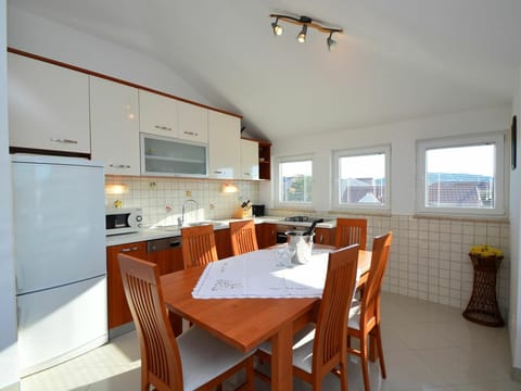 Furniture, Table, Property, Chair, Window, Wood, Cabinetry, Orange, Tableware, Interior Design