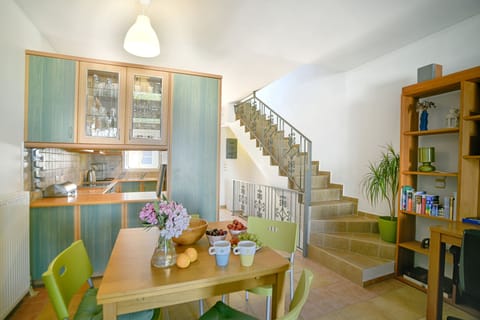 THE KITCHEN AND DINING AREA WITH SEATING FOR 8 PEOPLE