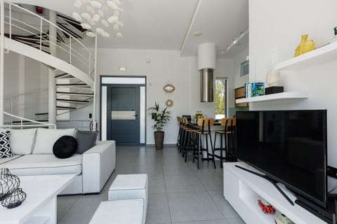 Living room settings for gatherings featuring a flat screen TV.