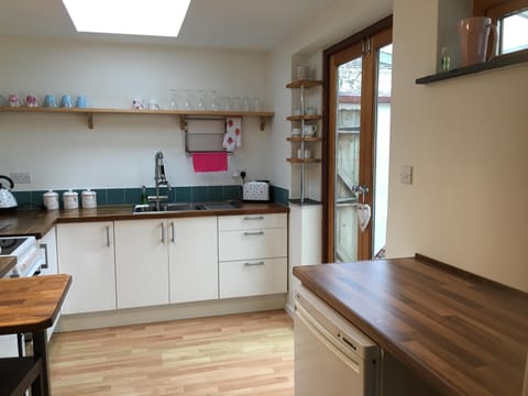 Kitchen area double doors lead onto courtyard