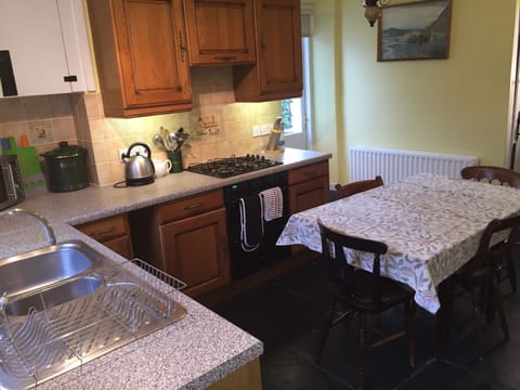 Kitchen with door leading to private riverside patio