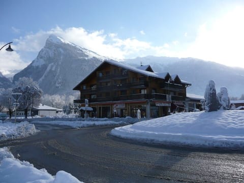 Les Rhodos apartments with ski hire shop, pizzeria and bakery on ground floor. 