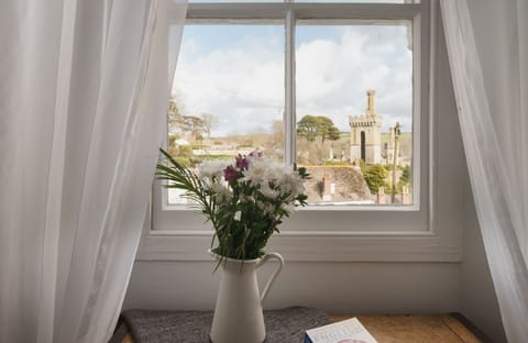 views to Place, Fowey Harbour, the estuary and hills beyond.