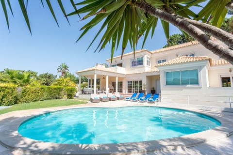 Luxury villa with pool and garden.