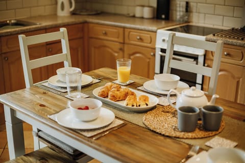 Spacious fully equipped kitchen with dining space.