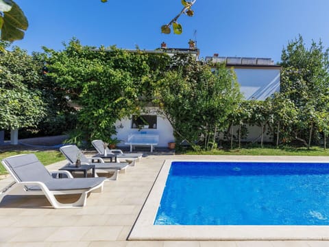 Water, Plant, Sky, Property, Swimming Pool, Azure, Shade, Outdoor Furniture, Architecture, Grass