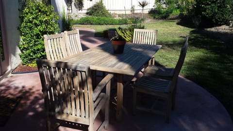 Private Patio with dining for six in fenced back yard