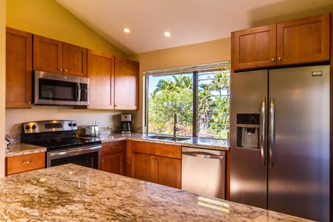 Updated & expanded kitchen with granite counters & stainless steel appliances
