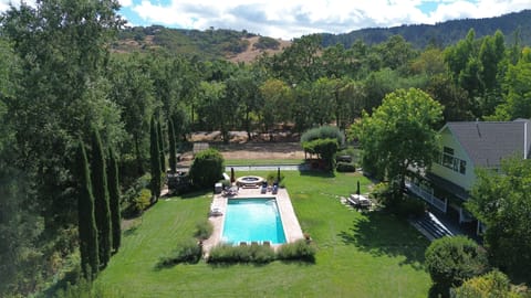 View southwest across rear of estate. Pool, spa, and bocce court just past spa.