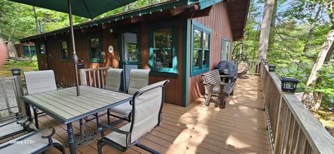 Wrap-around deck with seating for 6, love seat glider, egg chair and grill