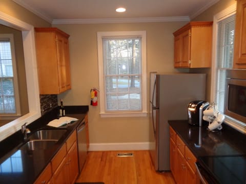 Microwave, cook top stove, refrigerator and Keurig. New flatware and cookware. 