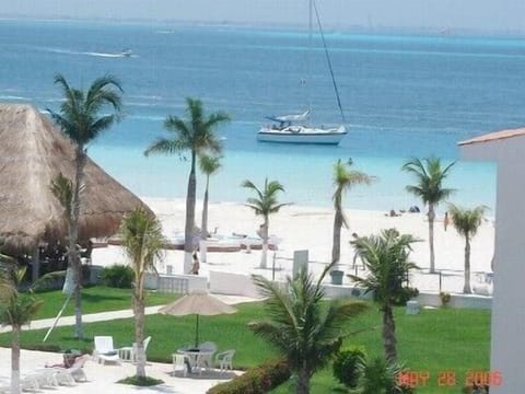 Our beach, La Palapa restaurant and part of pool view from our balcony.