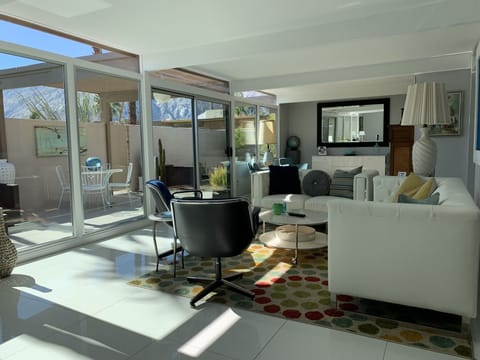 Main living area with view of patio and mountains.