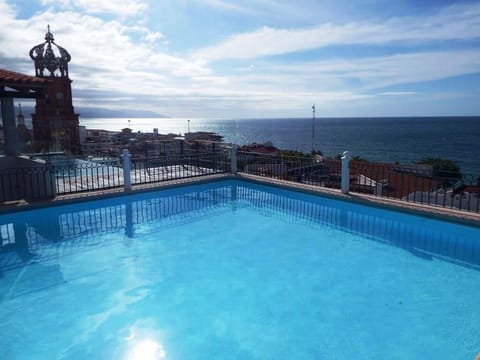 Pool and Southern portion of Banderas Bay and iconic church just steps away