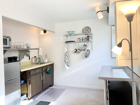 Kitchenette w/ mid-size refrigerator, Breville countertop oven, induction burner