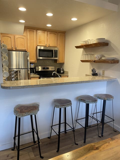 Additional seating at the counter looking into kitchen.