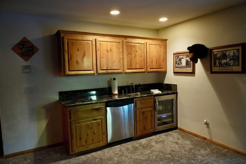 Game room wet bar, wine cooler and second dishwasher.