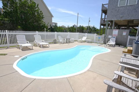 A sparkling 9' x 22' private swimming pool stands waiting to kickstart your beach vacation!