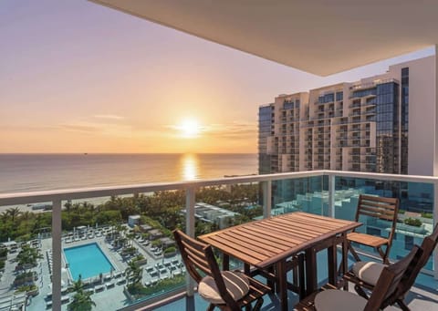 "Golden hour magic from your private balcony—sunset views, poolside serenity, and coastal charm!"
