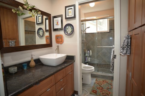  your private bath with walk-in shower. Toilet has a bidet with heated seat.