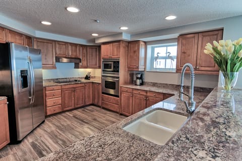Spacious kitchen with stainless appliances, granite counter. Beach and pier v