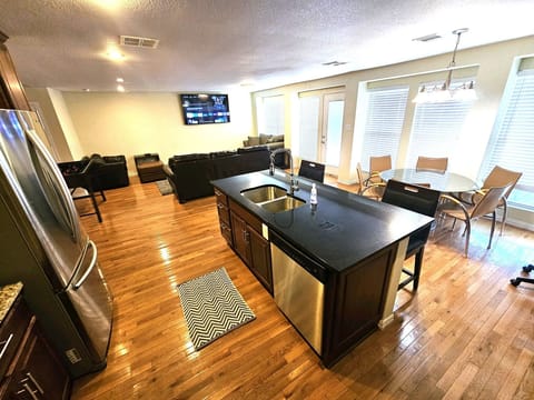 View of the family room 70" smart TV & dedicated study table.