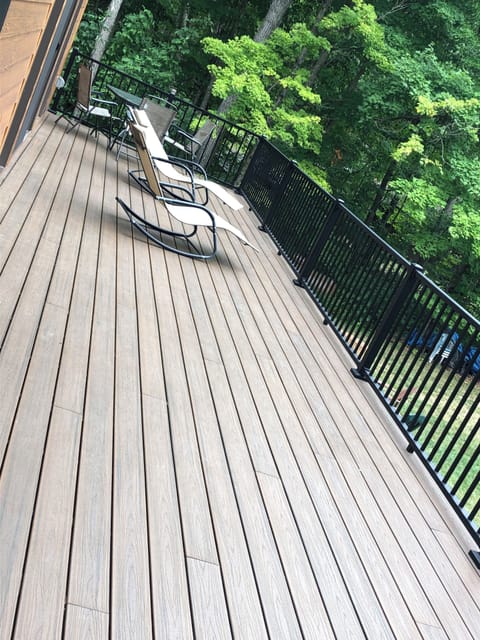 Very large deck overlooking the yard and lake. 