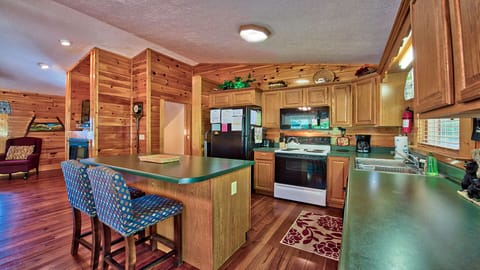 Kitchen area with seating at the bar