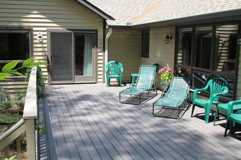 deck with 2 lounge chairs/tables, 4 seat dining table