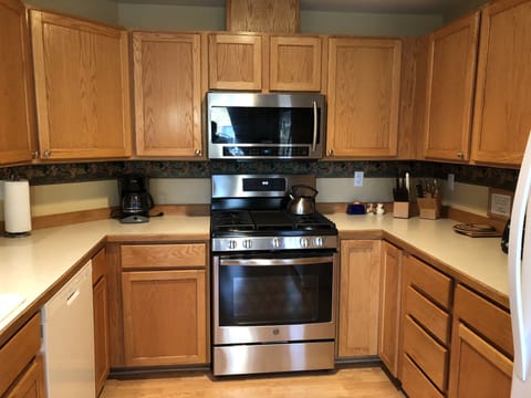 Cook gourmet meals on the new gas range in Kitchen