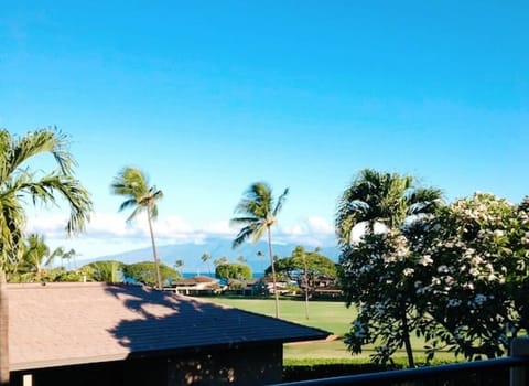 View of the golf course and ocean from the lanai.