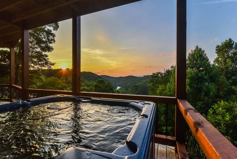 Soak your cares in the 6-person hot tub while overlooking the Toccoa River
