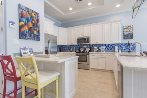 Spacious kitchen fully equipped with kitchen utensils and extra seating!