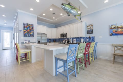 Spacious kitchen fully equipped with kitchen utensils and extra seating!