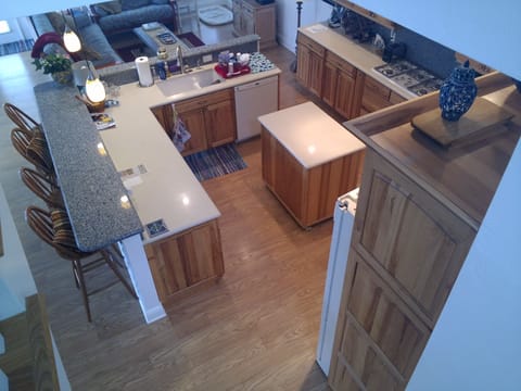 Another kitchen view showing bar seating for 4.