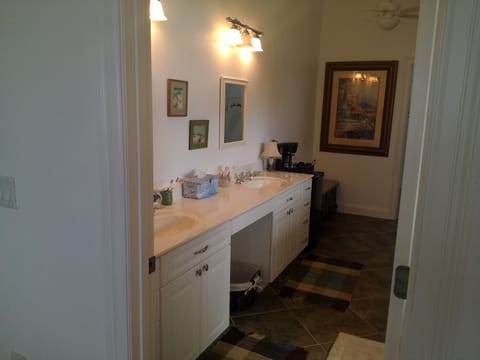 Upstairs master bathroom with 2 sinks, separate toilet area, large closet. 
