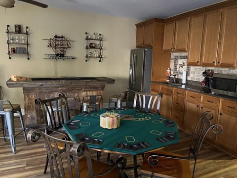 Bar and card table in recreation room on garden level.
