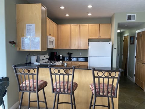Extremely well stocked kitchen and and comfy barstools