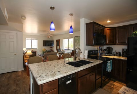 View from kitchen & dining area, bright & sunny living room with views & Lg TV!