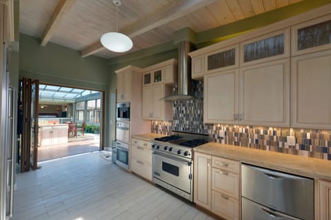 The kitchen is fully equipped with high end appliances.