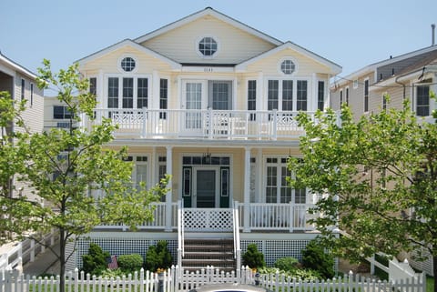 Front of house with a big sunny front porch