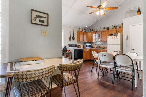 Whip up delicious meals and enjoy family gatherings! Our vacation rental features a spacious and fully equipped kitchen with ample dining space, ready for all your culinary adventures