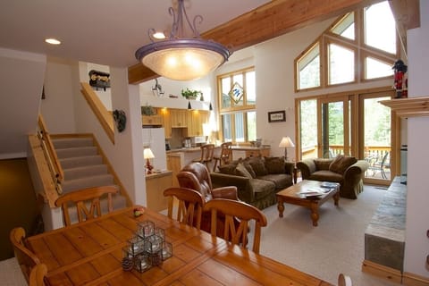 Looking out from the DR to the Great Room and kitchen with massive sunlight