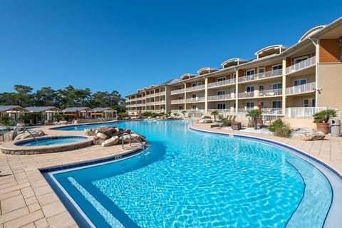 Our 4 pool 2 hot tub pool deck follows the shape of our 64 unit complex
