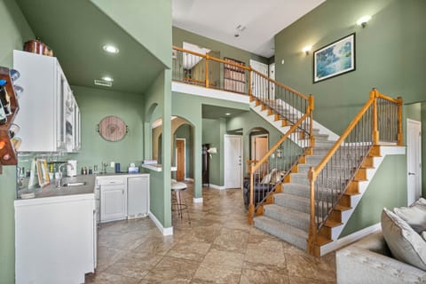 Open floor plan with comfy seating, smart TV, and dreamy panoramic views of Lake Travis.