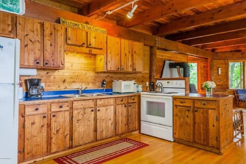 Kitchen has plenty of cookware, utensils, etc.